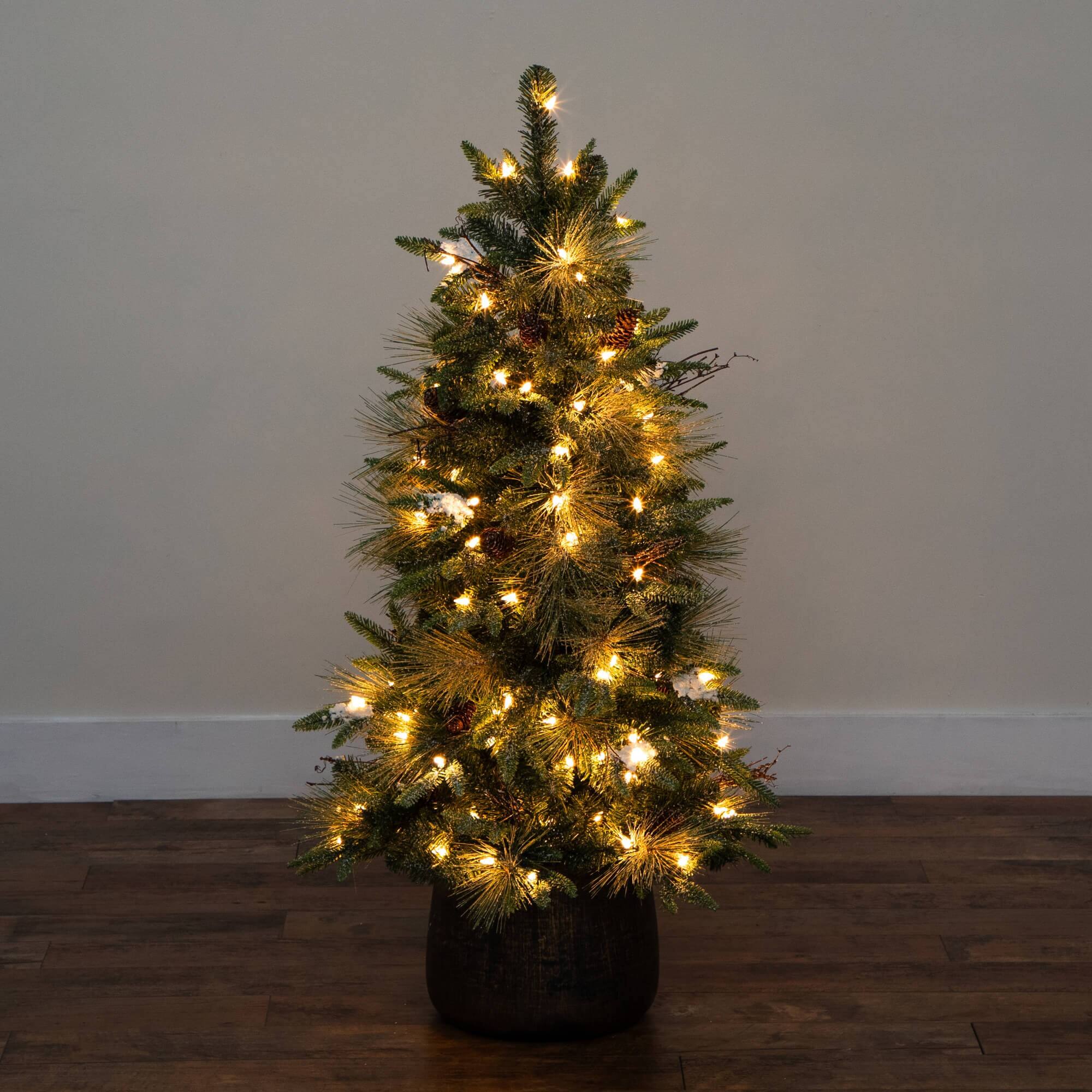 4ft. Pre-Lit Mixed Pine Snowed Artificial Christmas Tree with Pinecones in Decorative Planter, Warm White LED Lights